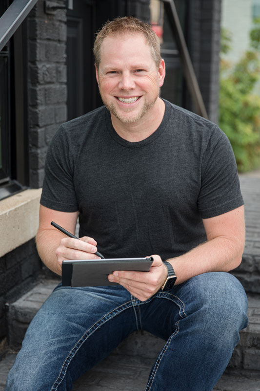 Branden Bodendorfer planning on a tablet with the Key2Success digital planner