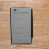 Digital planner displayed on a wooden surface, featuring a PDF Decision Journal layout, compatible with various PDF apps like GoodNotes and Notability.