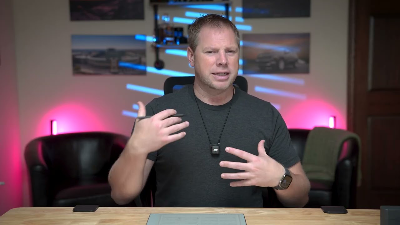 Person demonstrating decision-making concepts with a reMarkable tablet in a modern workspace, featuring colorful lighting and motivational visuals.