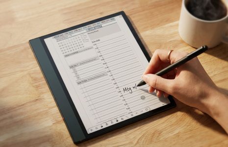 Onyx Boox 5c open to Key2Success Planner daily page on a clean workspace desk