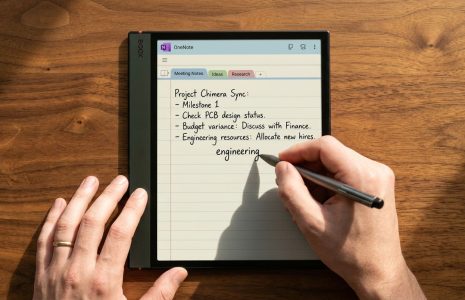 Onyx Boox 5c with OneNote open showing handwritten meeting notes being written with stylus